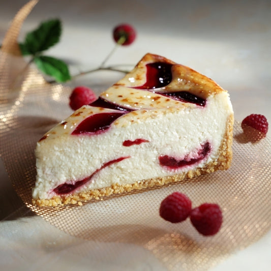 White Chocolate with Raspberry Cheesecake – 28 Slices (2 Cakes, 14 Slices Each)